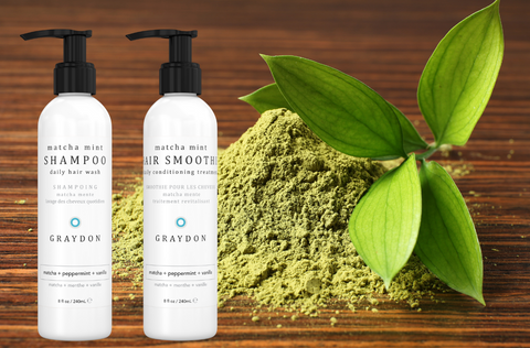 Graydon Skincare Matcha Minto Shampoo and Matcha Mint Hair Smoothie in front of match powder and plant leaves