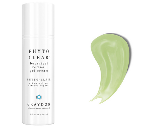 A retinol alternative face moisturizer in a white bottle next to a smear of the product
