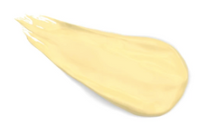 A swatch of yellow-coloured moisturizer for irritated skin against a white background