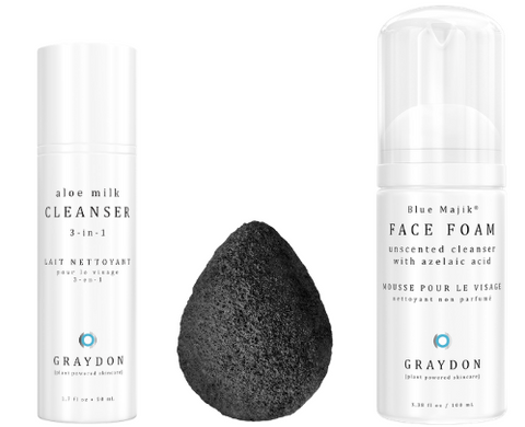 A cleanser for dry skin next to a bamboo charcoal sponge and foaming cleanser for combination skin