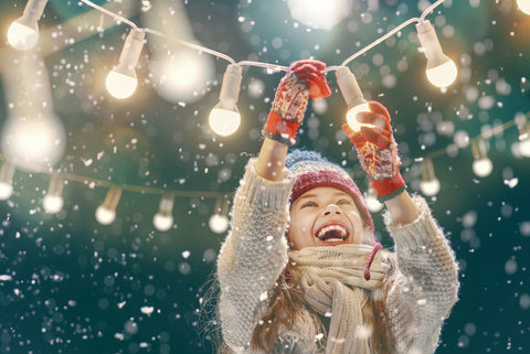 Little Kid Enjoying Snow And Festivities