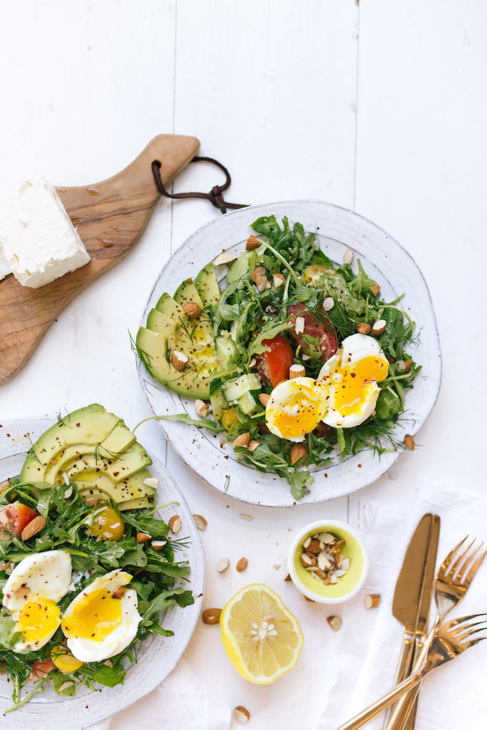 brunch salad with soft boiled egg and avocado