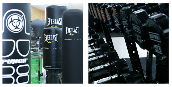 boxing bags and dumbbells on display in fitness equipment store
