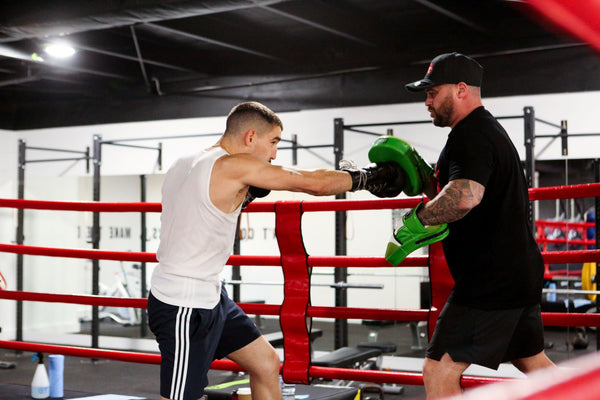 Sparring practice in boxing ring