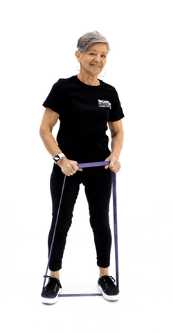Old woman using purple resistance band