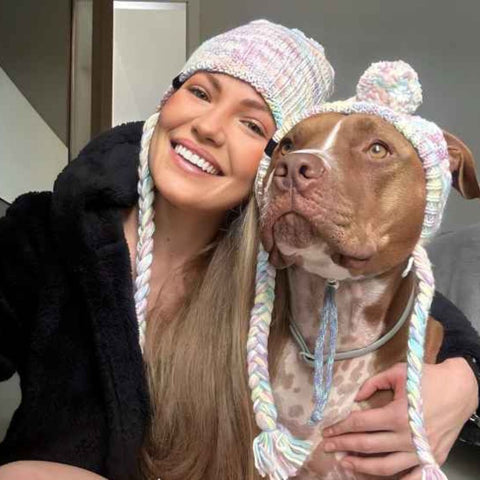 Pitbull and owner with matching beanies