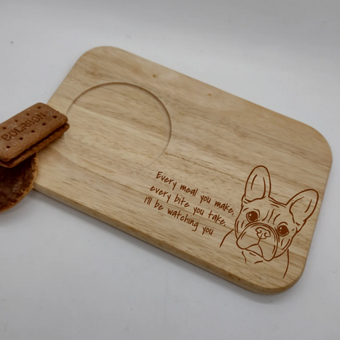 a wooden cutting board with a french bulldog print