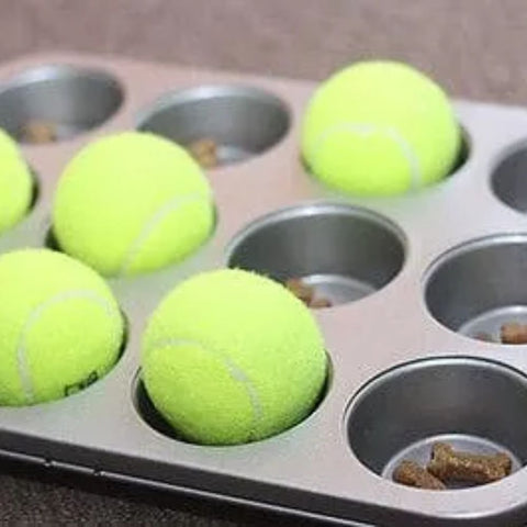 a muffin tin filled with tennis balls
