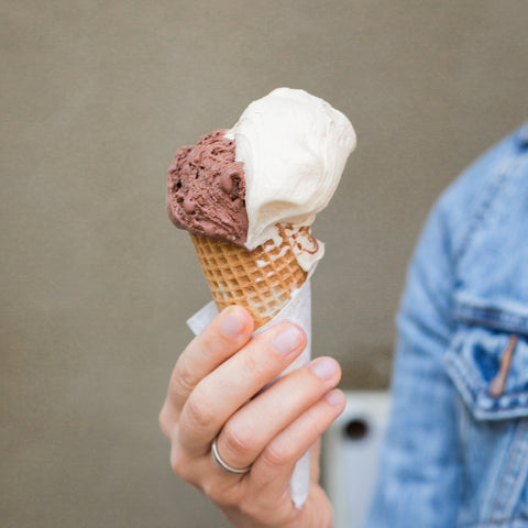 a lady holding an ice cream cone