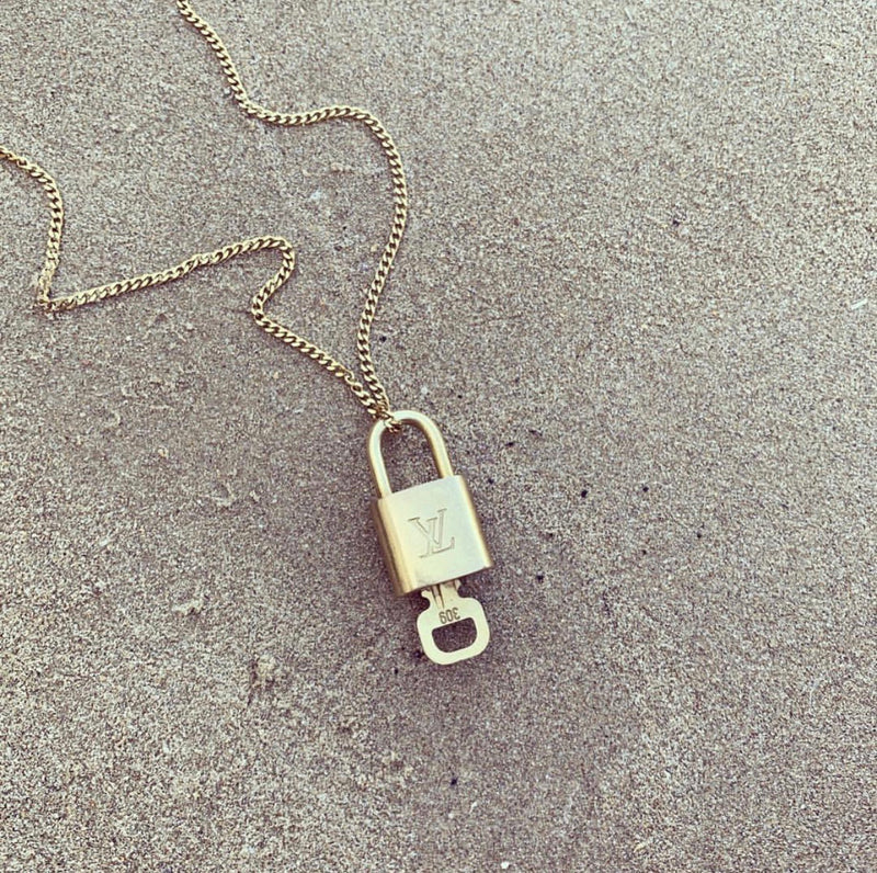 Louis Vuitton Gold Metal Love Lock Pendant Necklace For Sale at 1stDibs  louis  vuitton love lock necklace, louis vuitton love lock pendant, love lock  pendant louis vuitton