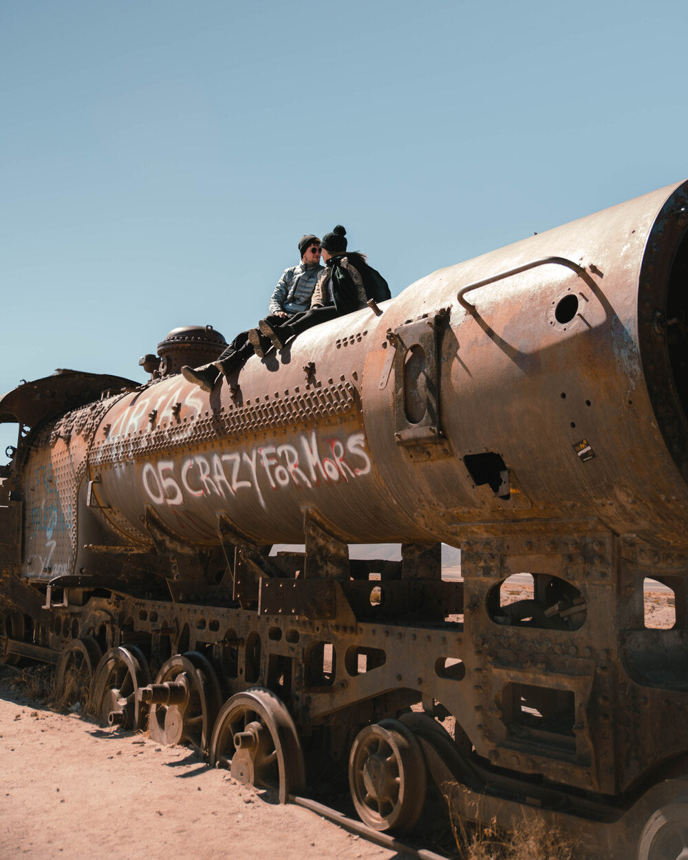 WhatTheChic and Lost LeBlanc at train cemetery in Bolivia