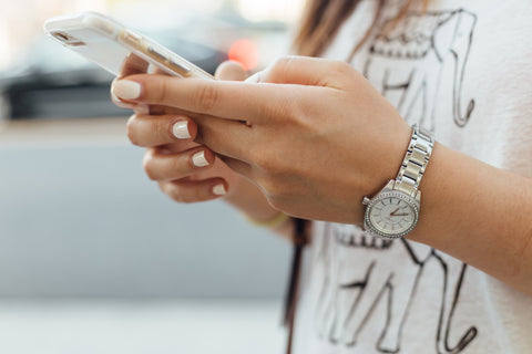 iPhone in use in woman's hands