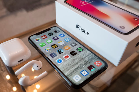iPhone X with Airpods and iPhone box