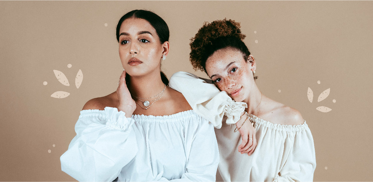 Two young women leaning on each other