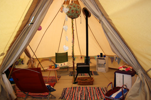 Glawning interior showing stove and chimney near the central pole