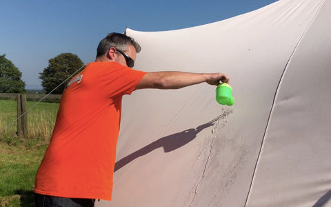 Pouring water over the canvas