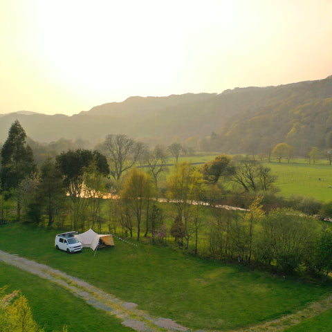 Glawning and van in field