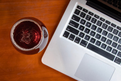 photo of laptop with a glass of beer - Virtual Team Trivia Event Instructions