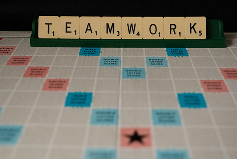 Scrabble board spelling "teamwork"