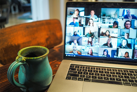 Close-up image of a laptop open to a virtual meeting