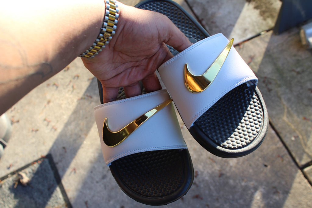 burgundy nike slides with gold check