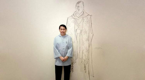 Benedictine monk Dom Martin de Jesus Gomez (a.k.a. Gang Gomez) stands before one of his liturgical vestment designs in 2014