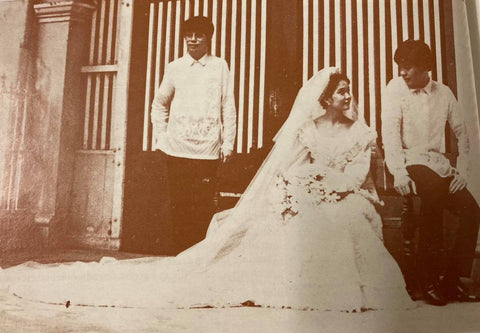 Gang Gomez (left) stands with his sister (center) and brother-in-law (right) at their wedding. Gomez and his brother-in-law wear tailored piña barongs with all over calado 