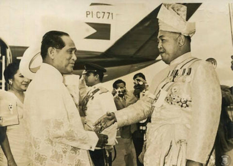 President Garcia shakes hands with the Yang di-Pertuan Agong (Supreme King) of Malaysia at Kuala Lumpur airport on February 8, 1961. He wears a barong tagalog