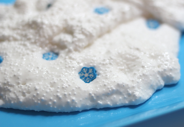 "Snow floam" craft made out of glue, styrofoam balls, and laundry starch, with little snowflake sparkles.