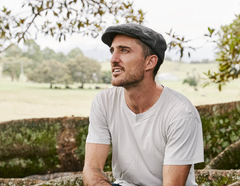 man wearing a herringbone drivers cap