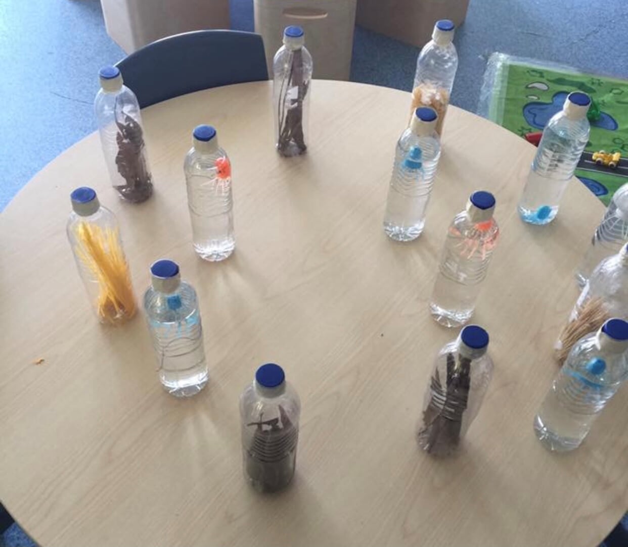sensory play with recycled drink bottles
