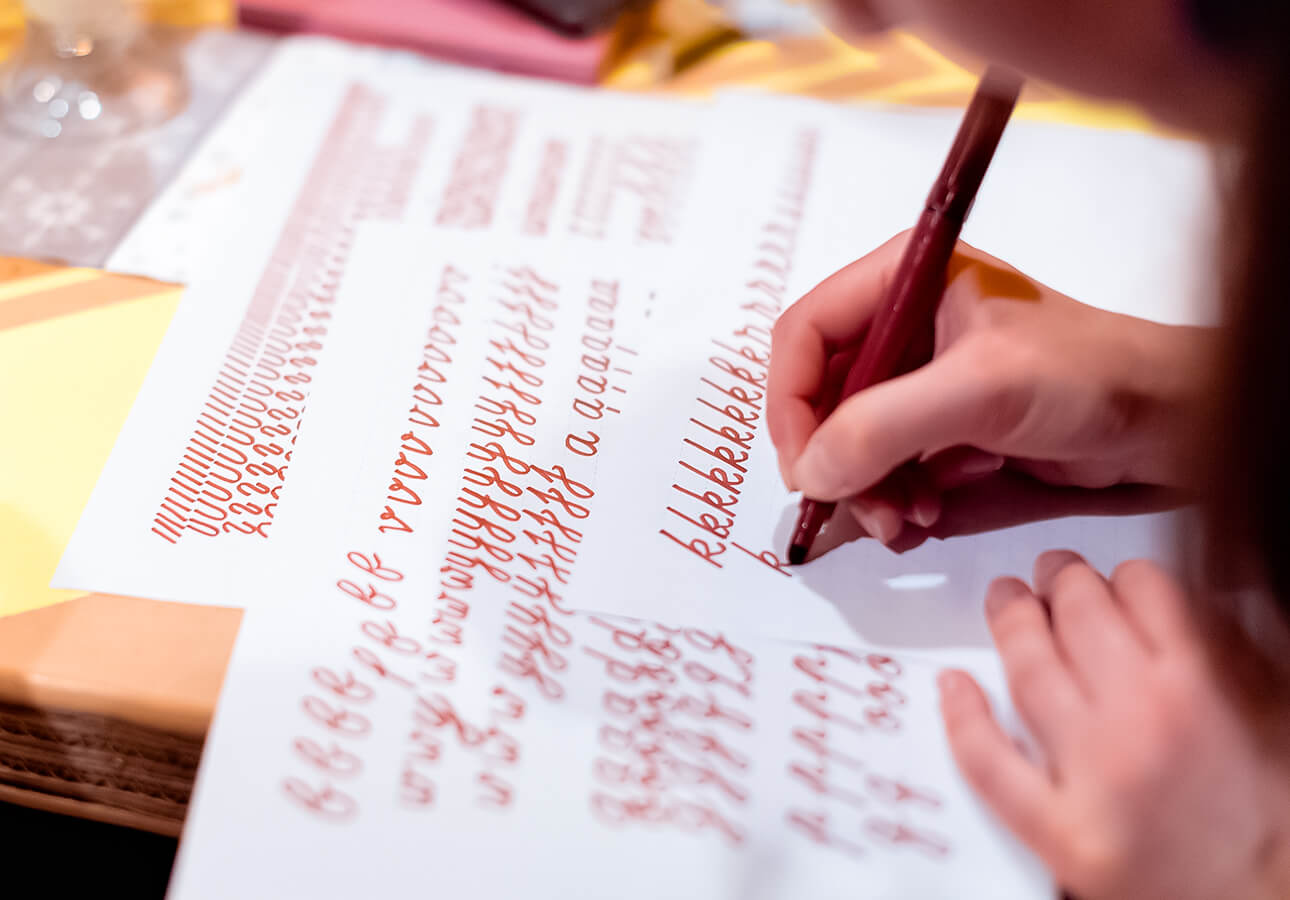 A person working on lettering.