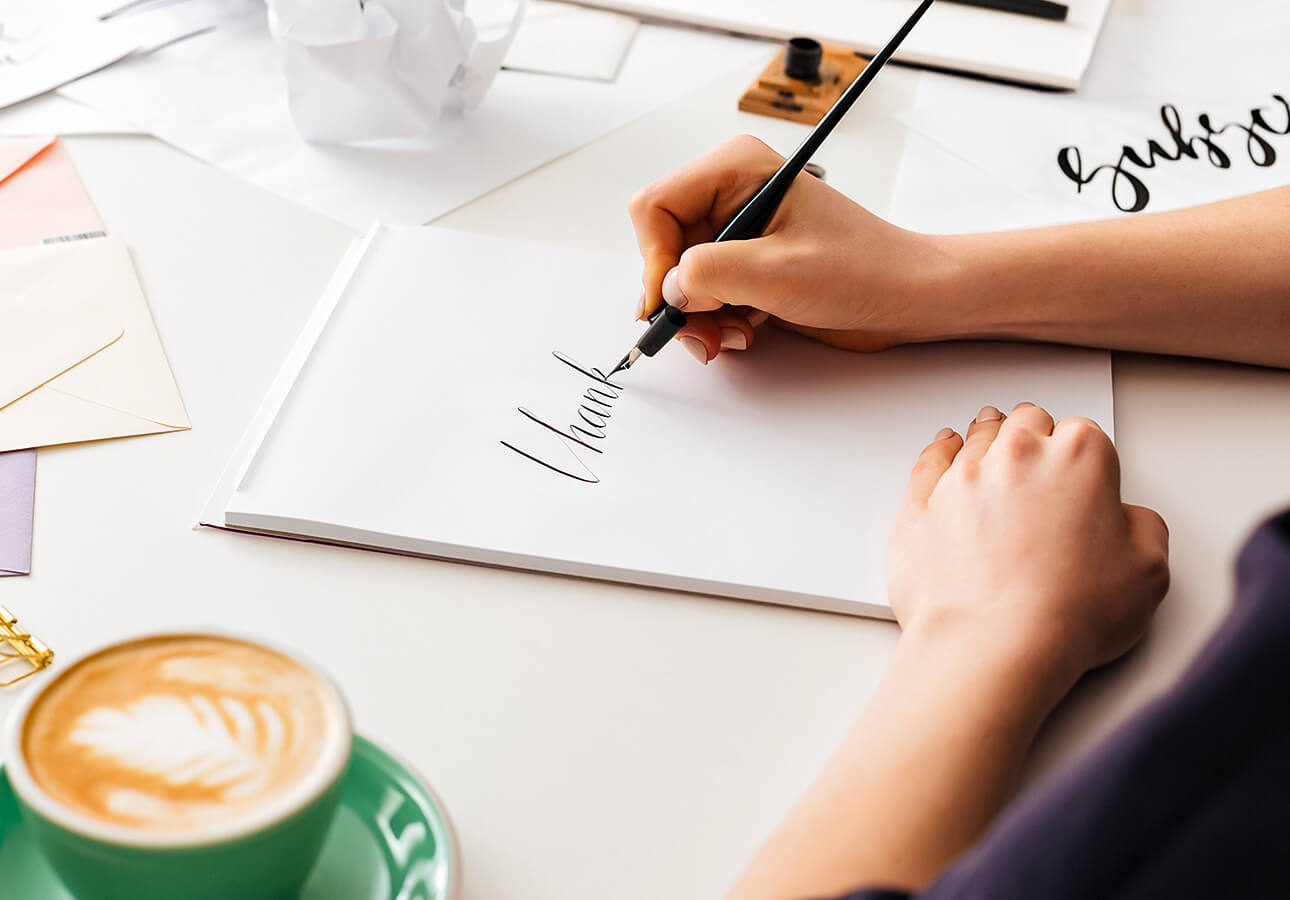 A person doing calligraphy.