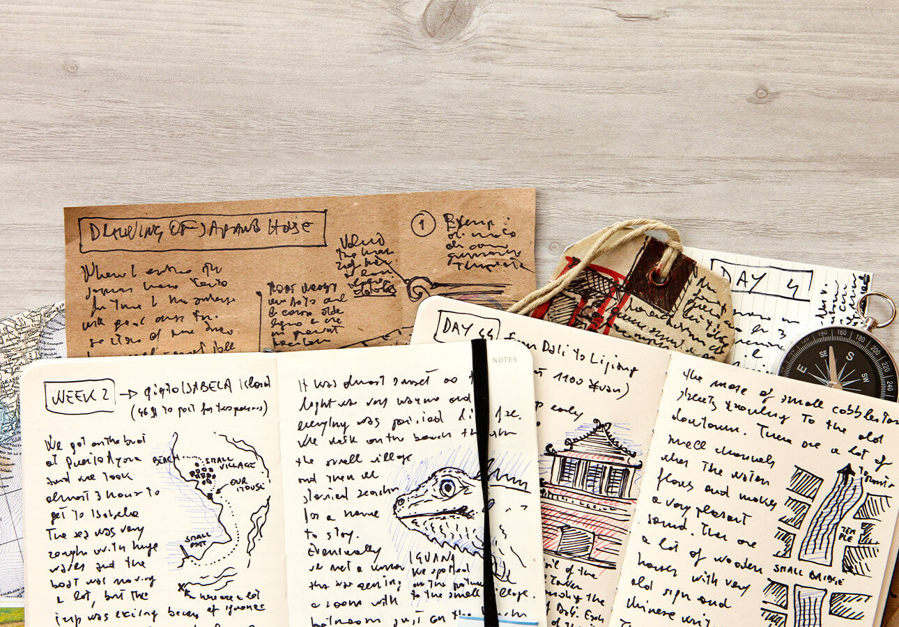 An collection of notebooks filled with handwritten notes and accompanying illustrations.