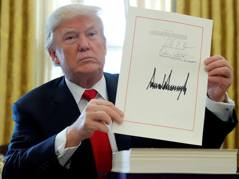 President Donald Trump with a signed US law