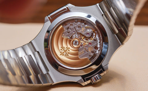 a rear view of a Patek Philippe Nautilus moonphase shows the rear crystal and the movement inside the case