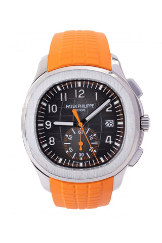 A Patek Philippe Aquanaut watch is shown in front view with its orange strap.