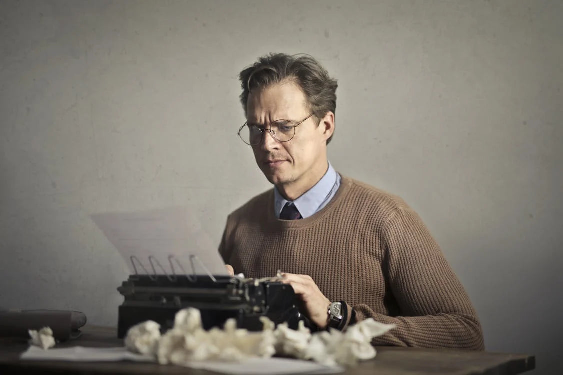 an author at his typewriter