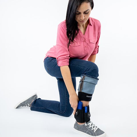 Woman choosing concealed carry position with ankle holster