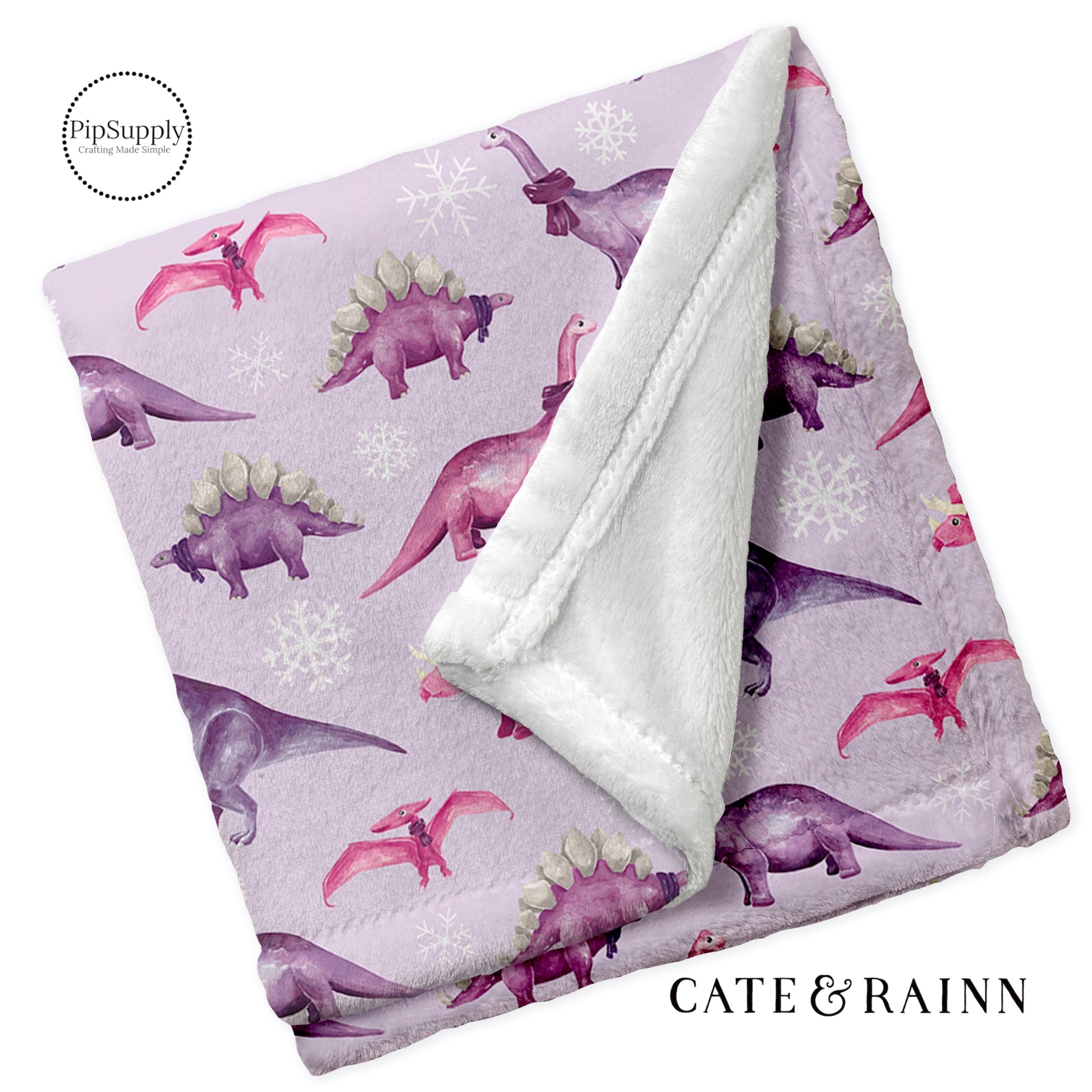 Custom Printed fleece blanket. Purple dinosaur and snowflake patterned soft folded minky fur blanket.