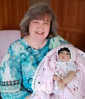 Michelle S with Baby Blessing.png__PID:8c8f8e80-72f2-4177-8de1-864162819eae
