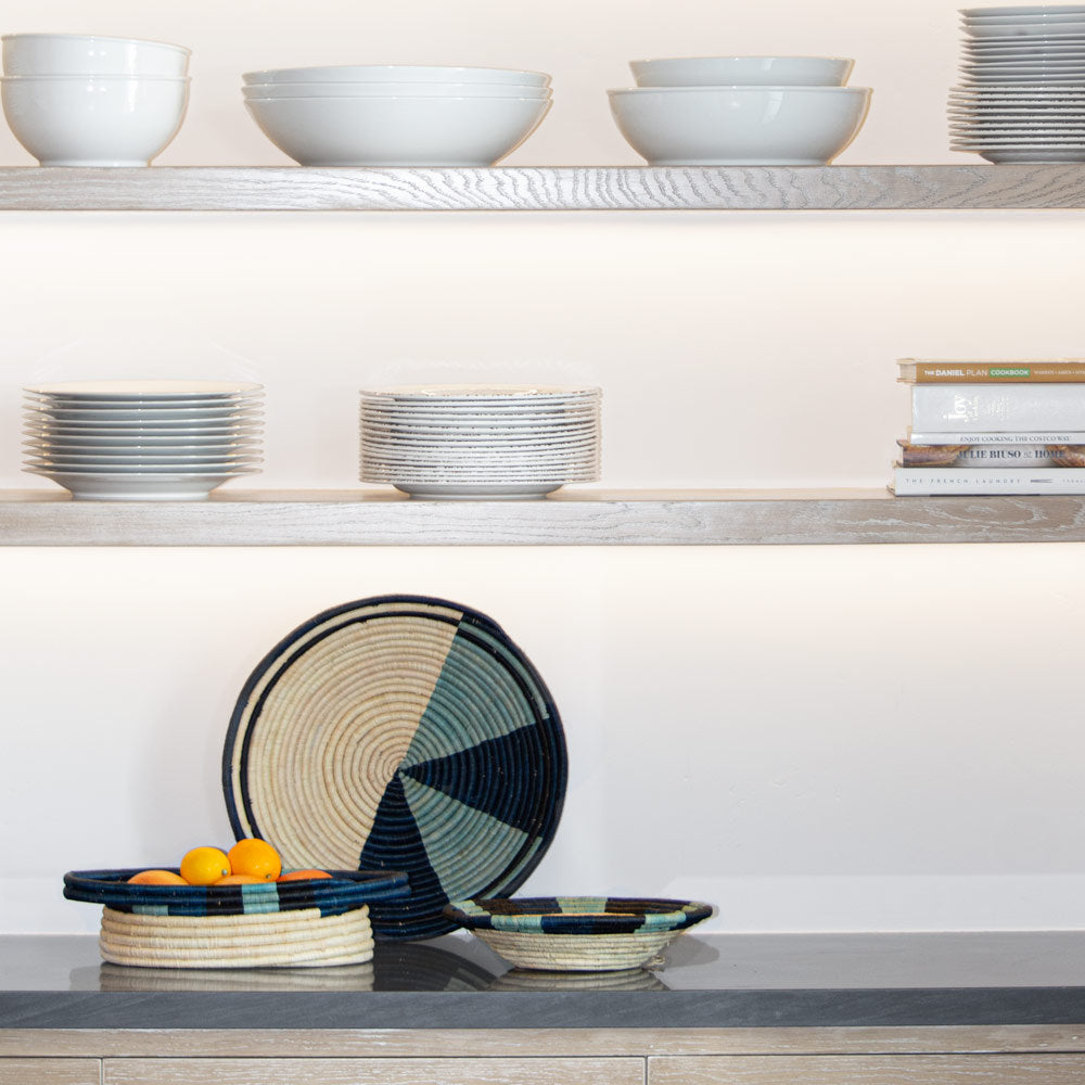 A tidy and organized kitchen shelf, showcasing neatly stacked plates