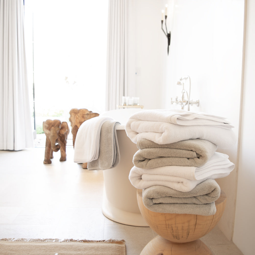 Wooden shelving in a gray bathroom