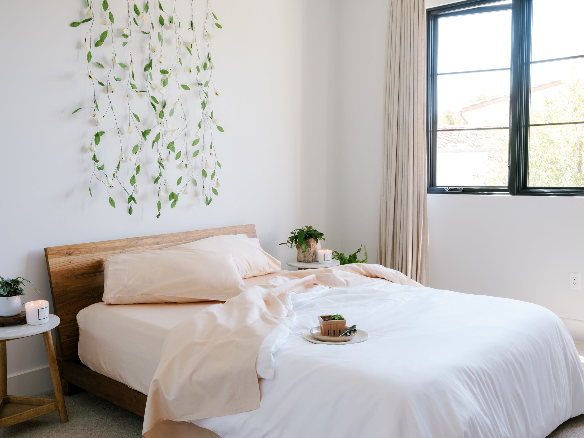 Apricot bed sheets complement the neutral bedroom decor