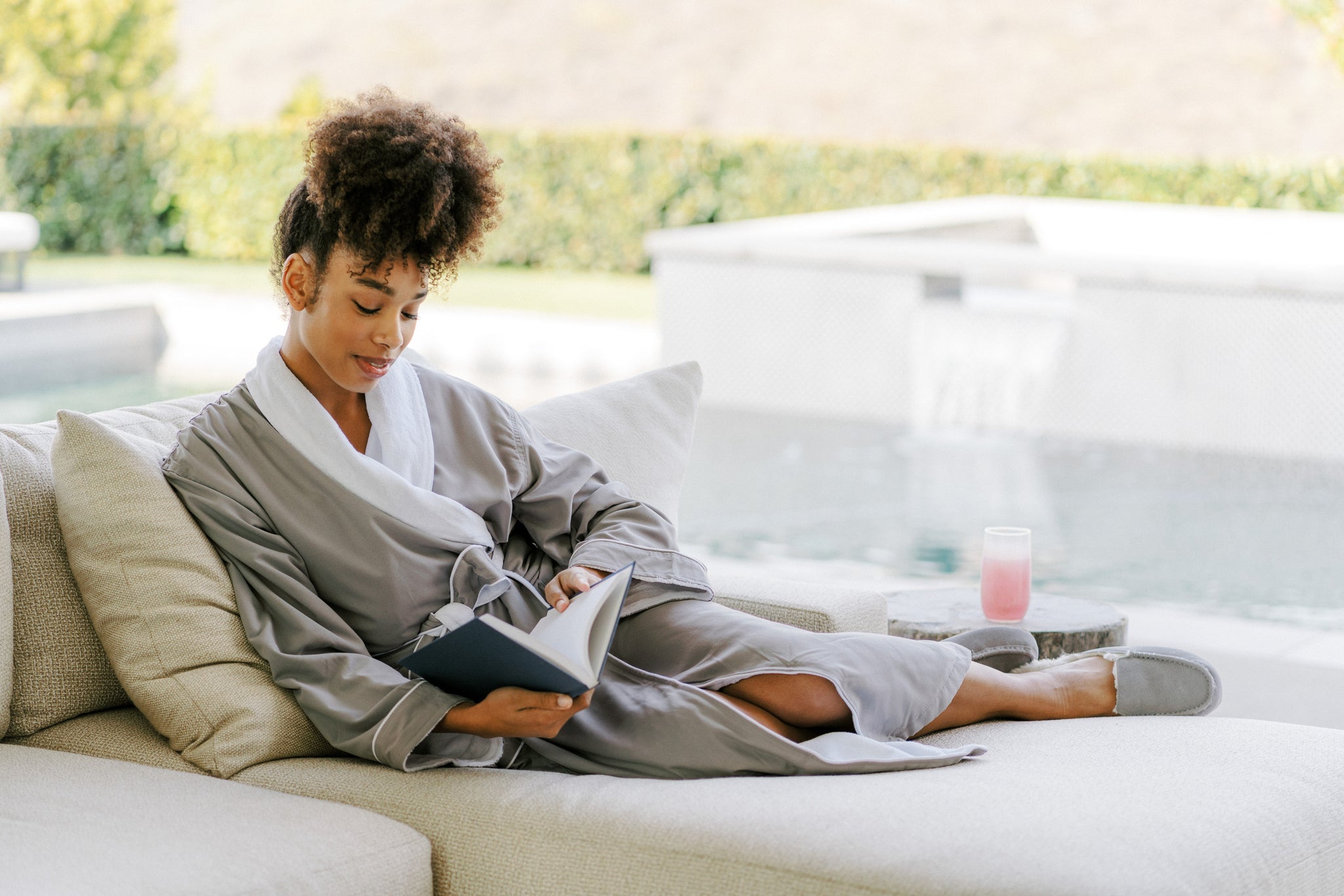 A person journaling in a peaceful, sunlit corner of their home