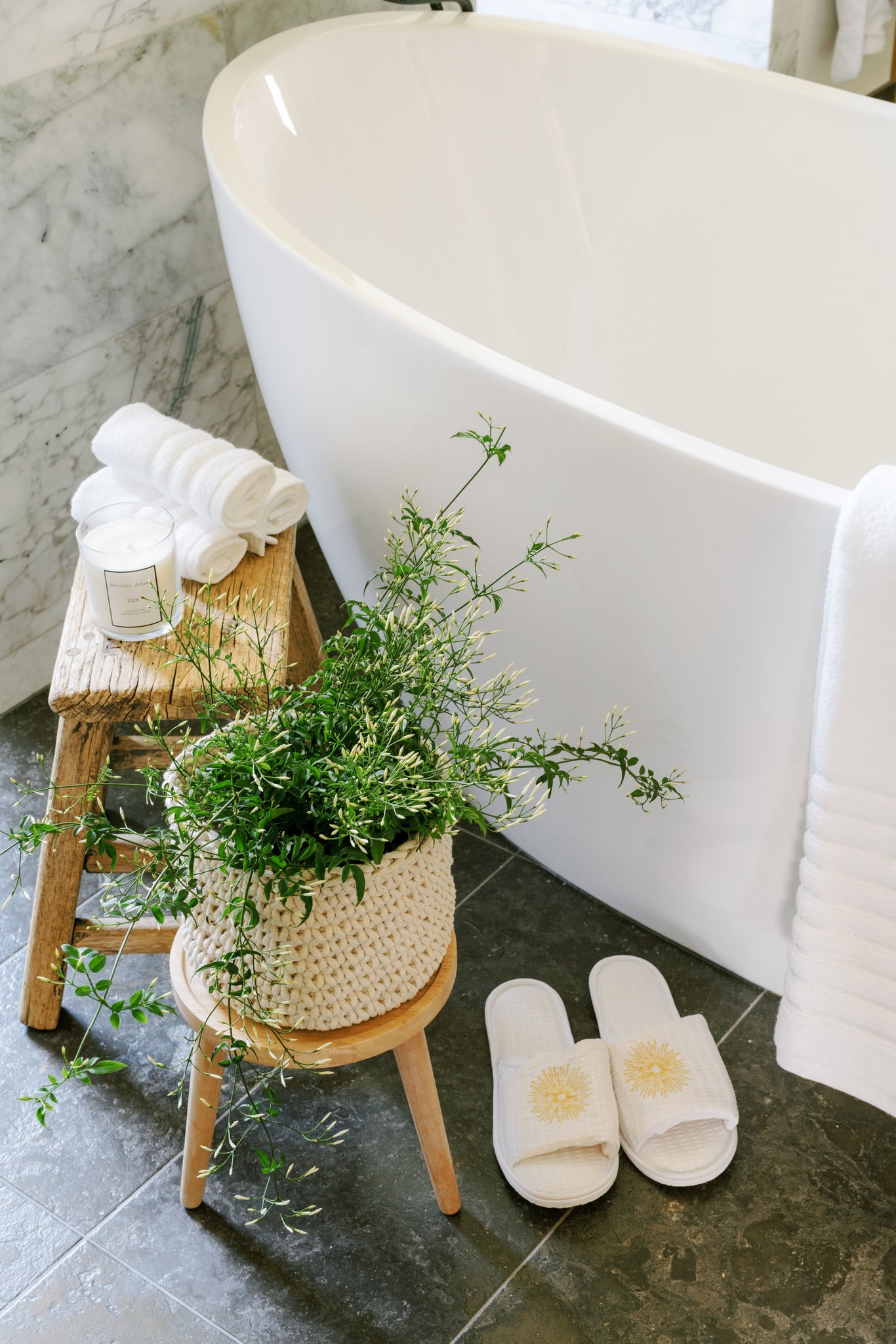 Bathroom transformed into a serene spa retreat with scented candles and soft music