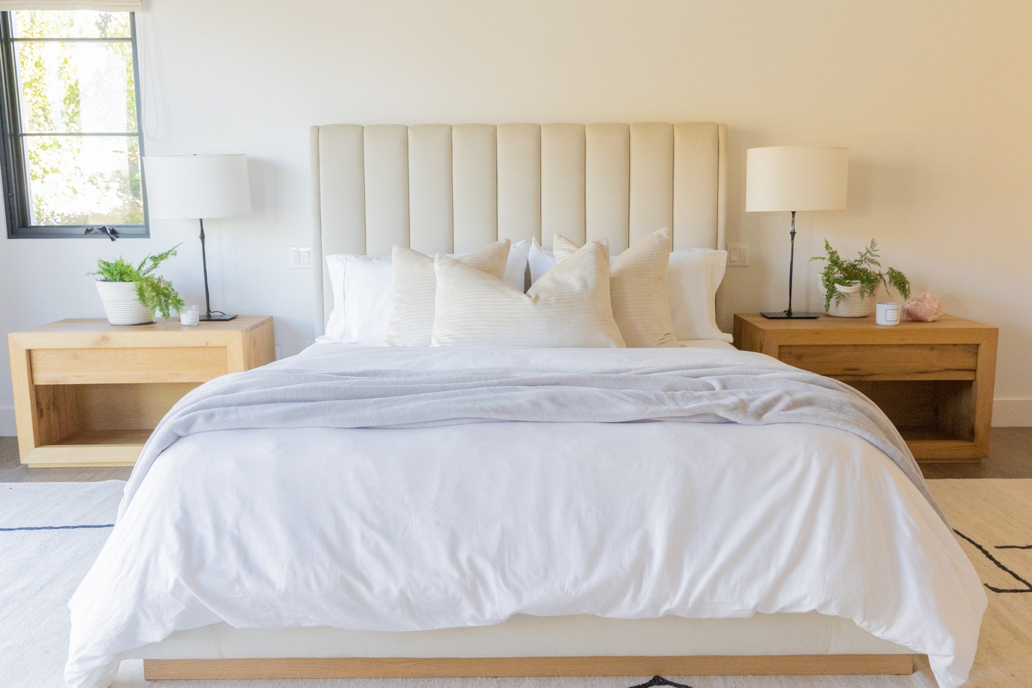 A folded throw blanket placed at the foot of the bed