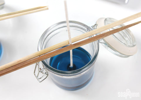 how to center a candle wick with chopsticks