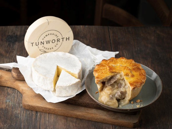 Mud Foods Tunworth Cheese Pie alongside a wheel of Tunworth cheese
