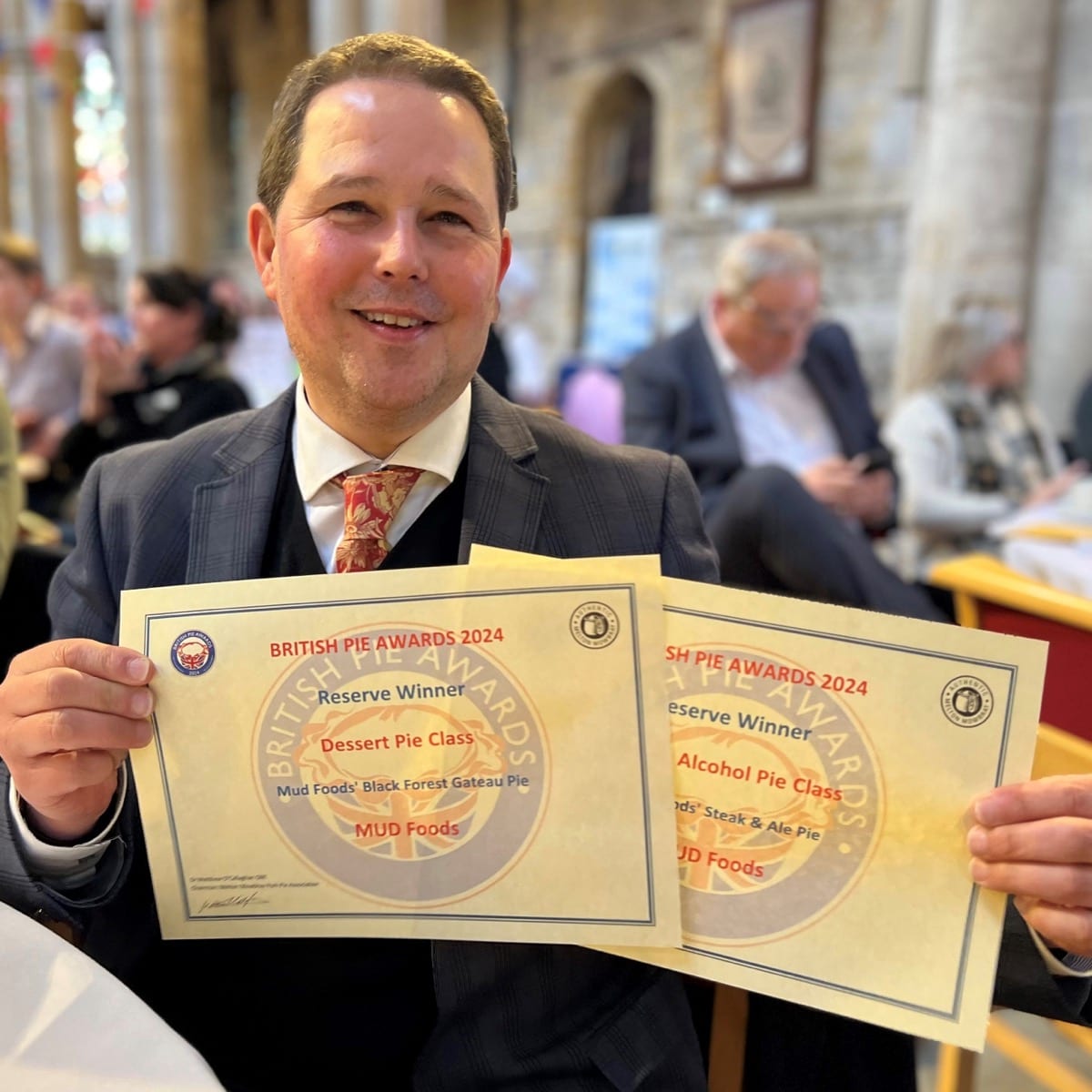 Christian with two certificates from the British Pie Awards